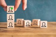 organization and team structure symbolized with cubes on wooden background