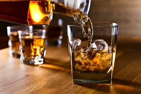 whiskey and natural ice on old wooden table