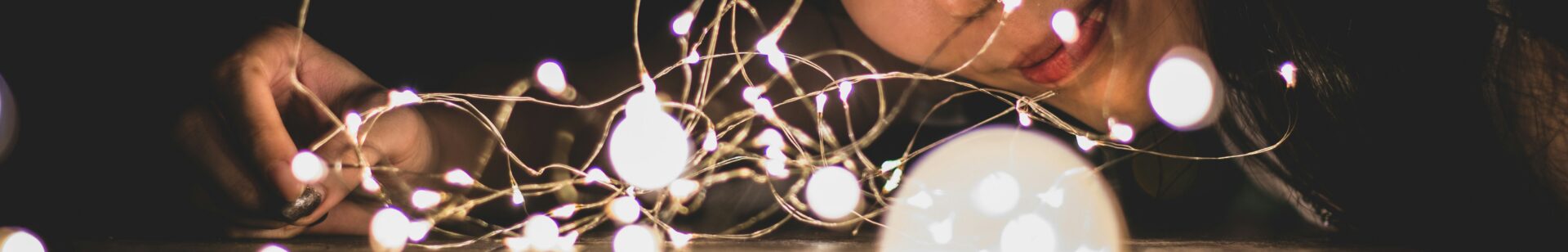 Image of a person looking down a chain of a string of lights | Boomi SAP