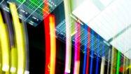 Abstract colorful light streaks overlaying a digital dashboard interface, symbolizing high-speed data fabric orchestration and SAP ERP modernization.
